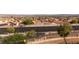 Picturesque view highlighting the neighborhood rooftops, street, and distant mountains on a sunny day at 2191 Bay Club Dr # 204, Laughlin, NV 89029
