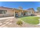 Backyard showcasing patio, synthetic lawn, and desert landscaping at 2268 Alanhurst Dr, Henderson, NV 89052