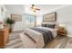 Relaxing bedroom with neutral décor, wood-look flooring and natural light at 2268 Alanhurst Dr, Henderson, NV 89052