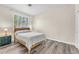 Cozy bedroom with wood-look flooring and plantation shutters for natural light at 2268 Alanhurst Dr, Henderson, NV 89052