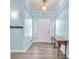 Inviting entryway with console table, coat rack, and natural light at 2268 Alanhurst Dr, Henderson, NV 89052