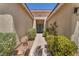 A welcoming entryway leads to the front door and lush landscaping at 2268 Alanhurst Dr, Henderson, NV 89052