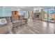 Bright living room with fireplace, backyard access, comfortable seating, and neutral decor at 2268 Alanhurst Dr, Henderson, NV 89052