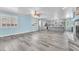 A spacious living room features light-colored walls and stylish wood-look floors at 2268 Alanhurst Dr, Henderson, NV 89052