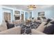 Comfortable seating area with built-in bookshelves and stone fireplace at 2268 Alanhurst Dr, Henderson, NV 89052