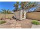 Backyard storage shed, landscaping, brick wall and gravel base at 2268 Alanhurst Dr, Henderson, NV 89052