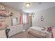 Cozy bedroom with whimsical decor, a single bed, and a bright, cheerful atmosphere at 2293 Sky Island Dr, Henderson, NV 89002