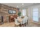 Dining room featuring modern decor, a brick wall and a window at 2293 Sky Island Dr, Henderson, NV 89002