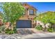 Two-story home featuring a landscaped front yard and a two-car garage at 2293 Sky Island Dr, Henderson, NV 89002