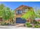 Two-story home featuring a landscaped front yard and a two-car garage at 2293 Sky Island Dr, Henderson, NV 89002