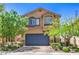 Charming two-story home featuring a landscaped front yard and a two-car garage at 2293 Sky Island Dr, Henderson, NV 89002