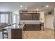 Well-equipped kitchen with granite counters, ample cabinet space, stainless steel appliances, and adjacent breakfast nook at 2293 Sky Island Dr, Henderson, NV 89002