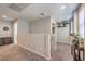 Open landing area with neutral carpeting, wall decor, and abundant natural light at 2293 Sky Island Dr, Henderson, NV 89002