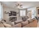 Bright living room featuring comfortable seating, a ceiling fan, and natural light at 2293 Sky Island Dr, Henderson, NV 89002