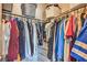 Organized walk-in closet with ample hanging space, shelving, and drawers for optimal storage at 2293 Sky Island Dr, Henderson, NV 89002