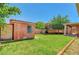 A spacious backyard featuring a well-maintained lawn and a small outbuilding at 2398 S Lamont St, Las Vegas, NV 89104