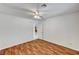 Bedroom with wood-look flooring, ceiling fan, and doorway to other areas at 2398 S Lamont St, Las Vegas, NV 89104
