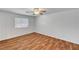 Bedroom with wood-look flooring, bright natural light, and ceiling fan at 2398 S Lamont St, Las Vegas, NV 89104