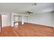 Bright bedroom with wood floors, ceiling fan and mirrored sliding door closet at 2398 S Lamont St, Las Vegas, NV 89104