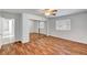 Bedroom featuring wood-look floors, a window, and a mirrored closet at 2398 S Lamont St, Las Vegas, NV 89104