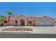 Charming single-story home featuring a red tile roof, desert landscaping, and an attached two-car garage at 2398 S Lamont St, Las Vegas, NV 89104
