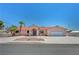 Charming single-story home with a red tile roof, manicured landscaping, and spacious driveway at 2398 S Lamont St, Las Vegas, NV 89104