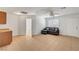 Comfortable living room includes a gray sectional sofa, tiled floors, and ceiling fan at 2398 S Lamont St, Las Vegas, NV 89104