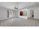 Spacious living room featuring tile flooring, a large window, and an open layout at 2398 S Lamont St, Las Vegas, NV 89104
