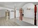 Bright living room featuring tile flooring, arched doorways, and a ceiling fan at 2398 S Lamont St, Las Vegas, NV 89104