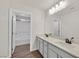 Bathroom with dual sinks, a large mirror, and a shower/tub combo at 2486 Dragon Fire Ln, Henderson, NV 89052