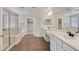 Spacious bathroom featuring double sinks, a walk-in shower, and a separate soaking tub at 2486 Dragon Fire Ln, Henderson, NV 89052