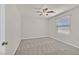 Spacious bedroom featuring neutral paint and carpet, with a ceiling fan at 2486 Dragon Fire Ln, Henderson, NV 89052