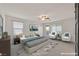 Bedroom featuring a ceiling fan, carpet flooring, balcony, and two armchairs at 2486 Dragon Fire Ln, Henderson, NV 89052