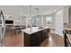 Open kitchen concept with island, granite countertops, stainless appliances and breakfast nook at 2486 Dragon Fire Ln, Henderson, NV 89052