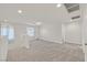 Bright living room with neutral paint and carpet and plenty of natural light at 2486 Dragon Fire Ln, Henderson, NV 89052