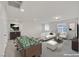 Bright, open-concept living room featuring modern design and a game table at 2486 Dragon Fire Ln, Henderson, NV 89052