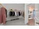 Spacious walk-in closet offering ample storage with visible clothing racks and shelves at 2486 Dragon Fire Ln, Henderson, NV 89052