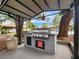 Outdoor BBQ area with grill and seating, perfect for summer cookouts and gatherings at 2606 S Durango Dr # 277, Las Vegas, NV 89117