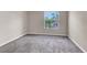Bedroom with carpet, a large window, and neutral paint, offering a serene retreat at 2606 S Durango Dr # 277, Las Vegas, NV 89117