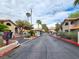 The gated community entrance with palm trees and well-maintained landscaping creates a welcoming atmosphere at 2606 S Durango Dr # 277, Las Vegas, NV 89117