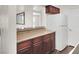The modern kitchen features sleek granite countertops and white appliances at 2606 S Durango Dr # 277, Las Vegas, NV 89117