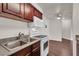 Cozy kitchen features sleek countertops, modern appliances, and wood-look flooring at 2606 S Durango Dr # 277, Las Vegas, NV 89117