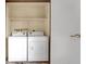 Convenient laundry area features side by side washer and dryer, with shelving above at 2606 S Durango Dr # 277, Las Vegas, NV 89117