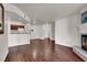 Open floor plan living room with adjacent kitchen, and a traditional fireplace at 2606 S Durango Dr # 277, Las Vegas, NV 89117