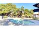 Enjoy the community pool surrounded by mature trees and lush landscaping at 2606 S Durango Dr # 277, Las Vegas, NV 89117