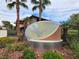 Community sign for Symphony, with lush plants, tropical trees, and appealing architecture at 2606 S Durango Dr # 277, Las Vegas, NV 89117