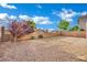 The backyard features low maintenance landscaping and a privacy wall at 2749 Invermark St, Henderson, NV 89044