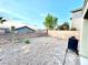 Enclosed backyard area featuring a gravel landscape, brick walls, and a clear view of the sky at 2749 Invermark St, Henderson, NV 89044