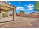 An expansive backyard with decorative rock landscaping and a patio area at 2749 Invermark St, Henderson, NV 89044