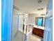 This bathroom features a tub, shower with sliding glass door, and a large mirror at 2749 Invermark St, Henderson, NV 89044